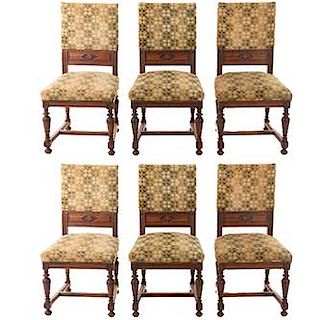 Lote de 6 sillas. Francia. Siglo XX. Enrique II. En talla de madera de nogal. Con respaldos cerrados y asiento en tapicería.