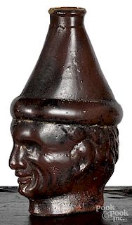Unusual pottery man's head flask