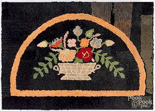 Hooked rug of a flower basket, early 20th c.