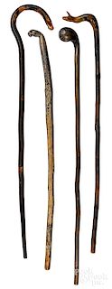 Four carved walking sticks, late 19th c.
