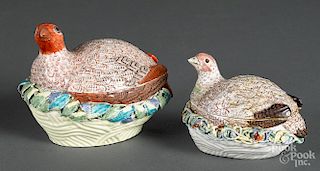 Two English porcelain quail on nest boxes