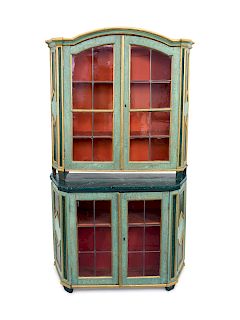 An Italian Painted and Parcel Gilt Two-Part Display Cabinet
Height 78 x width 46 x depth 21 inches.