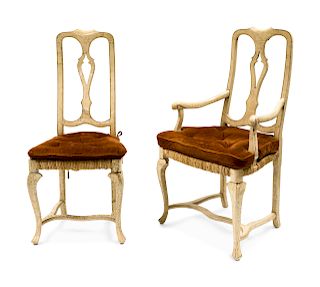 A Suite of Eight Italian Rococo Style Painted Dining Chairs
Height 42 1/2 inches.