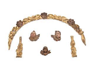 A Group of Six Italian Carved Giltwood Wall Mounts
Largest, height 19 x width 34 inches.