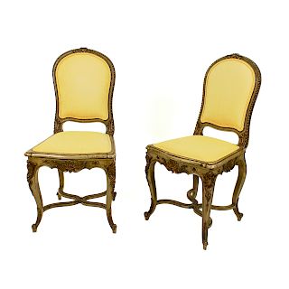 A Pair of French Louis XV Style Painted and Parcel Gilt Side Chairs
19TH CENTURY
having upholstered back rest and seat.
Height 36 1/2 inches.