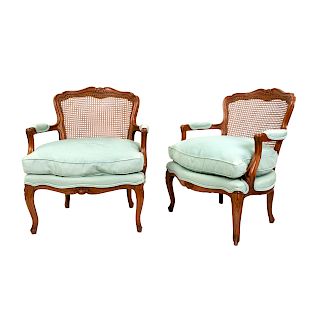 A Pair of French Provincial Louis XV Style Cane-Back Fauteuils
20TH CENTURY
having upholstered cushion seat and arm rests.
Height 33 inches.