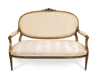 A Five-Piece Louis XVI Style Carved Giltwood Parlour Suite 
Canape, height 34 x width 54 inches.