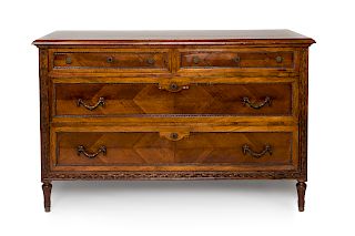 A Louis XVI Style Carved Fruitwood Commode 
Height 35 x width 54 1/2 x depth 24 inches.