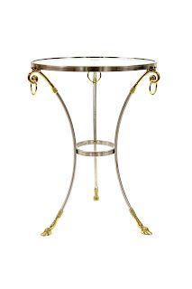 A Louis XVI Style Brushed Steel and Brass Glass Top Table
20TH CENTURY
Height 28 3/4 x diameter 21 1/2 inches.