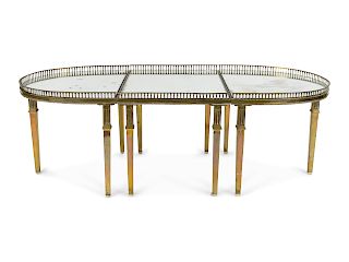 A French Empire Gilt Metal Surtout de Table
19TH CENTURY
in three parts, mounted as a coffee table raised on gilt metal legs.
Height 16 3/4 x width 49