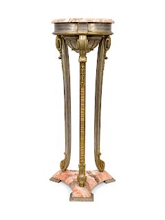 A Faux-Marble Painted and Carved Giltwood Jardiniere Stand
19TH CENTURY
Height 43 inches.