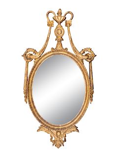 A Neoclassical Style Oval Giltwood Mirror
Height 48 inches.