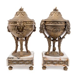 A Pair of Gilt Metal Urns on Onyx Bases
Height 13 3/4 inches.