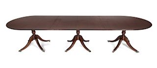 A Regency Style Mahogany Three-Pedestal Dining Table
Height 30 x total length 144 x depth 47 3/4 inches.