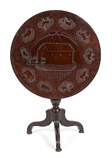 A British Colonial Carved Mahogany Tripod Table
Height 28 1/2 x diameter 29 inches.