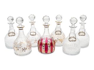 A Group of Seven Large Glass Decanters
Height of tallest 13 inches.