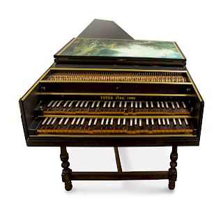 A Modern Black and Gilt Painted Double Manual Harpsichord
By Peter Fisk, 1989
raised on a trestle base.
Length 96 inches.