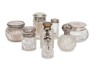 A Group of Six Silver or Brass Capped Glass Bottles and Two Silver Top Powder Jars
Height of tallest 4 1/8 inches.