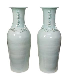 A Pair of Chinese Celadon Glazed Palace Vases
20TH CENTURY
the necks having applied salamanders.
Height 57 inches.
