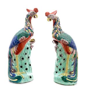 ligA Pair of Chinese Export Porcelain Phoenix Birds
EARLY 20TH CENTURY
on pierced bocage bases.
Height 19 1/2 inches.