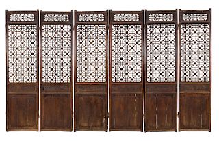 A Chinese Pierce-Carved Hardwood Six-Panel Floor Screen
Height 89 1/2 x width of each panel, 24 inches, extended 144 inches.