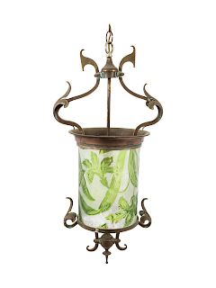 An Art Nouveau Brass and Molded Glass Hall Lantern
EARLY 20TH CENTURY
the glass shade having a green to clear foliate design.  
Height 25 inches.