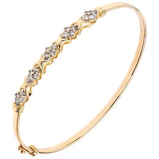 A diamond 14K yellow gold bangle bracelet. 