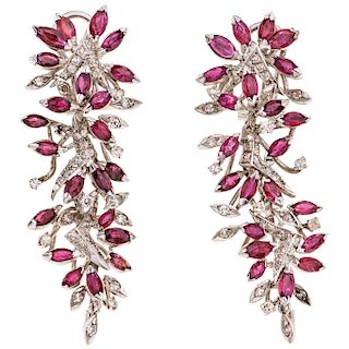 A ruby and diamond 18K white gold and palladium silver pair of earrings. 