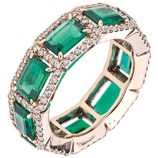 An emerald and diamond 14K pink gold ring. 