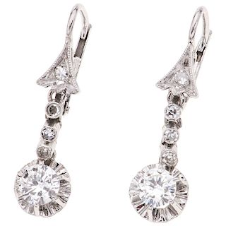 A diamond 14K white gold pair of earrings. 