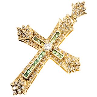 A diamond, emerald and simulant 14K yellow gold cross.
