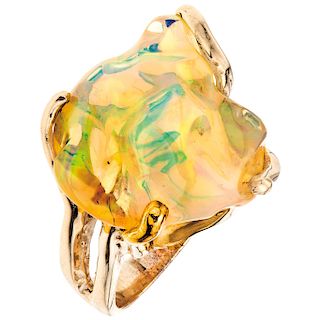An opal 14K yellow gold ring.
