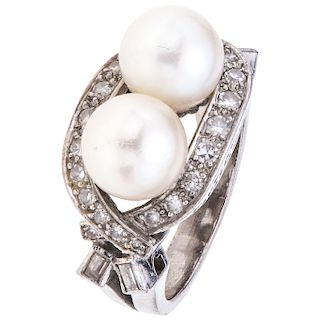 A cultured pearl and diamond palladium silver ring. 