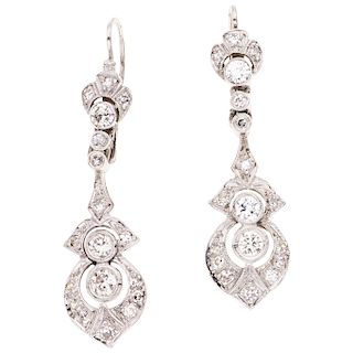A diamond palladium silver pair of earrings. 
