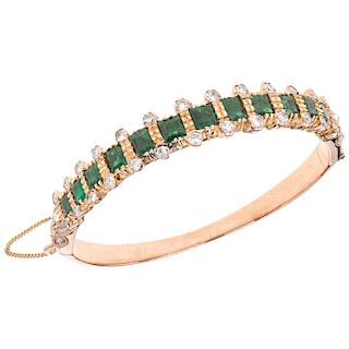 An emerald and diamond 10K pink gold bracelet.  