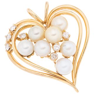 A cultured pearl and diamond 18K yellow gold pendant. 