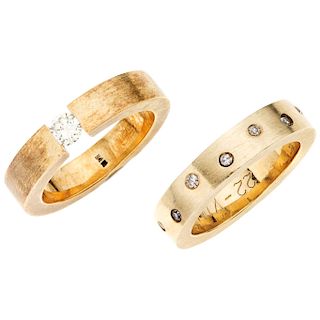 A diamond 14K yellow gold solitaire ring and ring. 