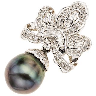 A cultured pearl and diamond 18K and 14K white gold pendant. 