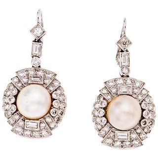 A half of cultured pearl and diamond palladium silver pair of earrings. 