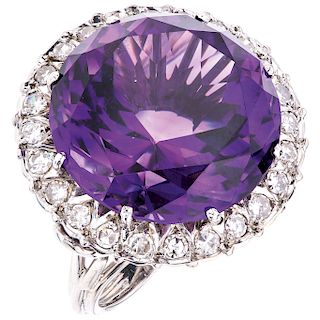 An amethyst and diamond 14K white gold ring.  