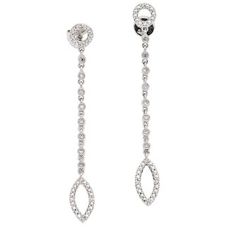 A diamond 14K white gold pair of earrings. 