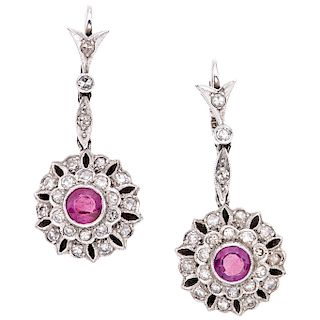 A ruby and diamond palladium silver pair of earrings. 