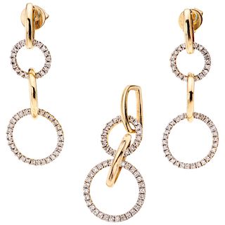 A diamond 14K yellow gold  pendant and pair of earrings set.