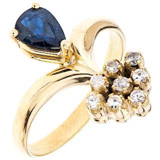 A sapphire and diamond 14K yellow gold ring. 