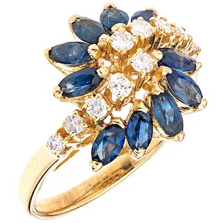 A diamond and sapphire 14K yellow gold ring.