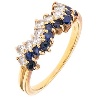 A diamond and sapphire 18K yellow gold ring. 