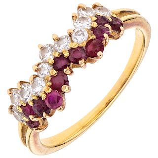 A diamond and ruby 18K yellow gold ring. 