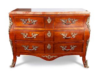 A Louis XV Style Bombe Chest
Height 33 1/2 x width 45 x depth 21 1/2 inches.