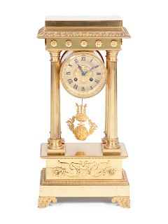 An Empire Style Gilt Bronze Portico ClockHeight 19 x width 9 x depth 5 inches.