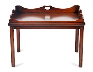 A Georgian Style Mahogany Butler's Tray Table
Height 19 3/4 x width 29 1/4 x depth 21 inches.